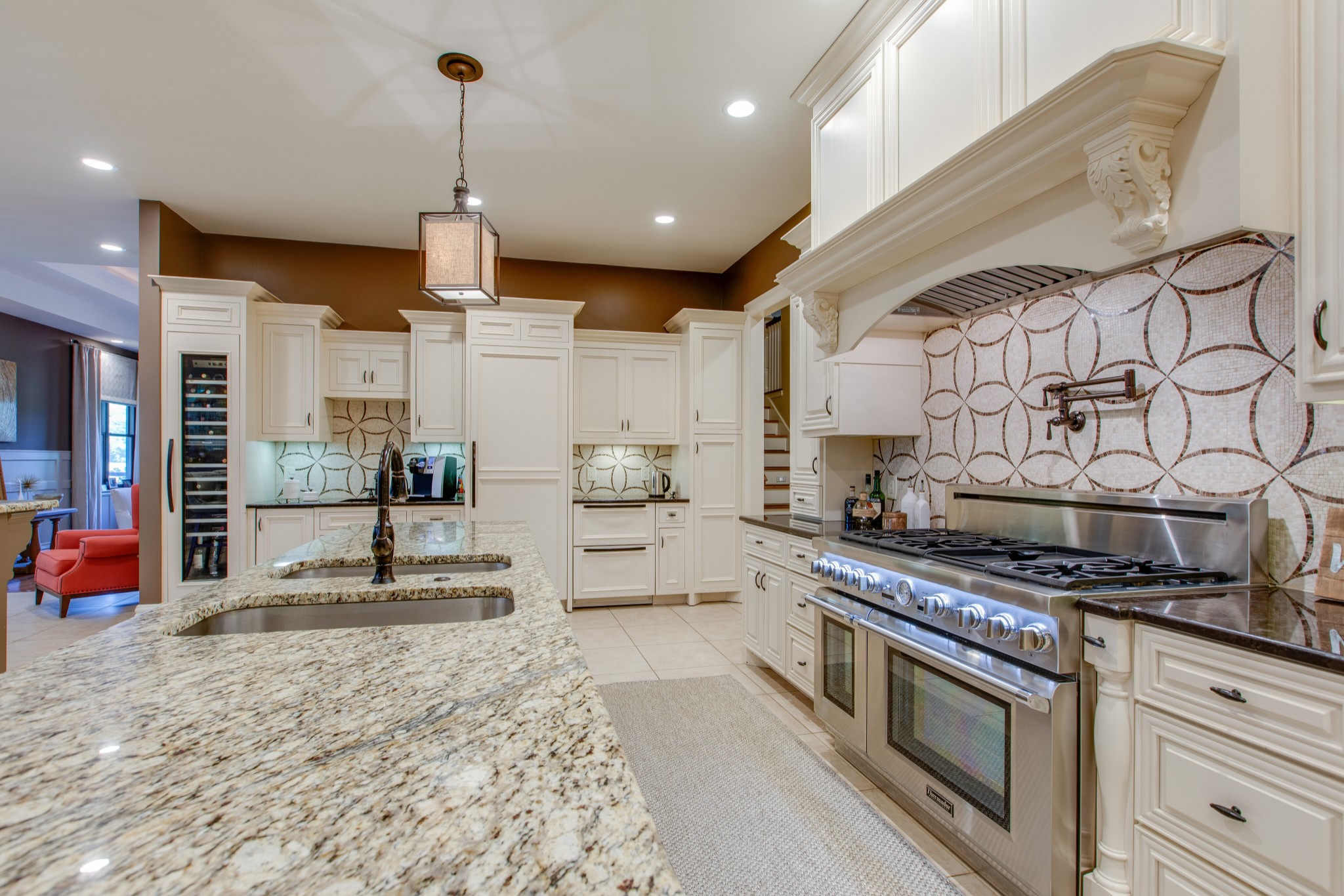 4200 Two Rivers Lane Franklin, TN 37069 - Photo 15 of 44 a kitchen with stainless steel appliances granite countertop a stove a sink and a refrigerator
