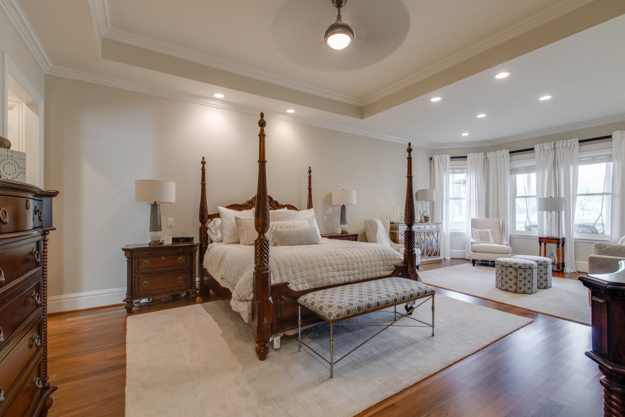 4200 Two Rivers Lane Franklin, TN 37069 - Photo 20 of 44 a spacious bedroom with a bed a couch and wooden floor