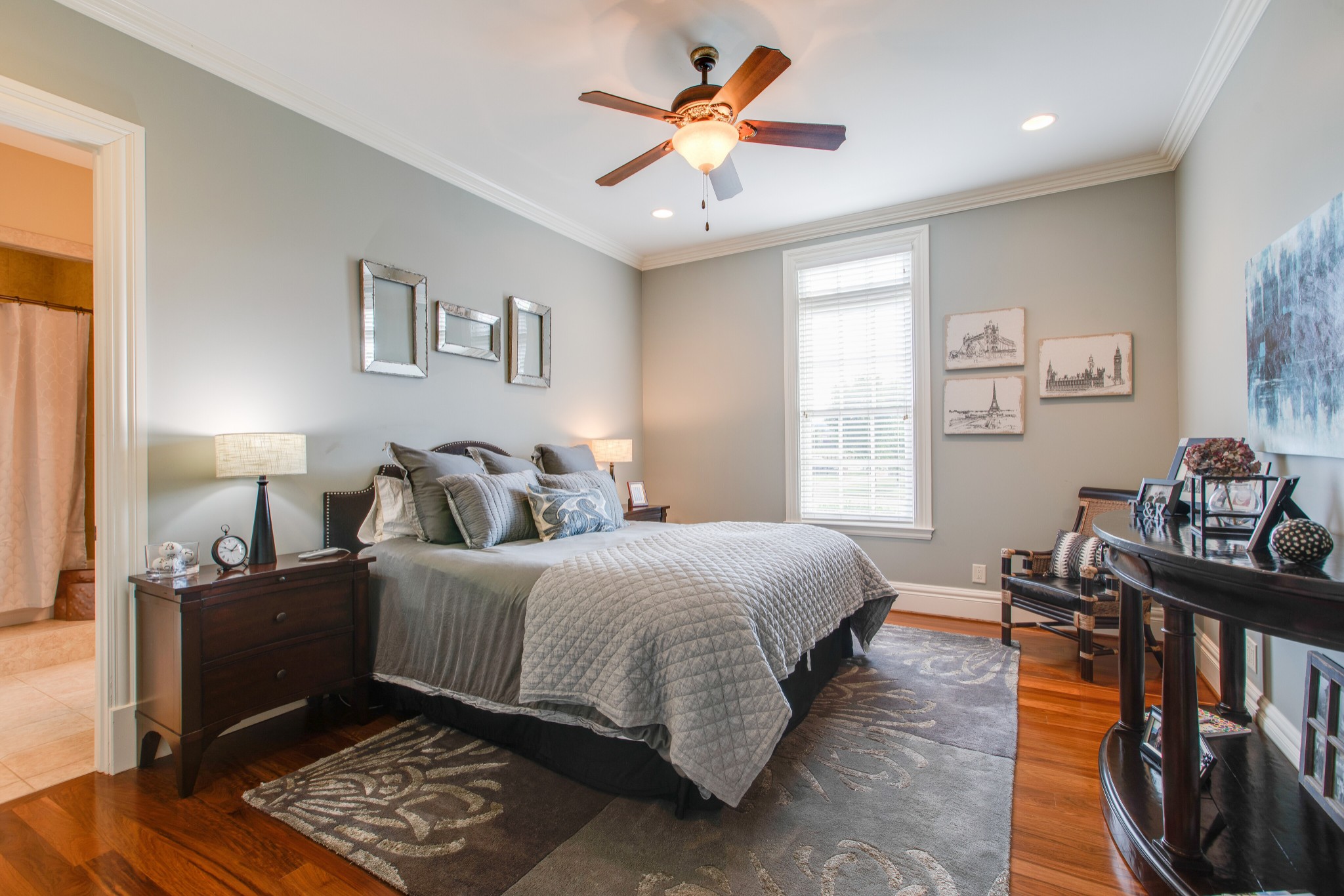 4200 Two Rivers Lane Franklin, TN 37069 - Photo 27 of 44 a bedroom with a bed and a chandelier