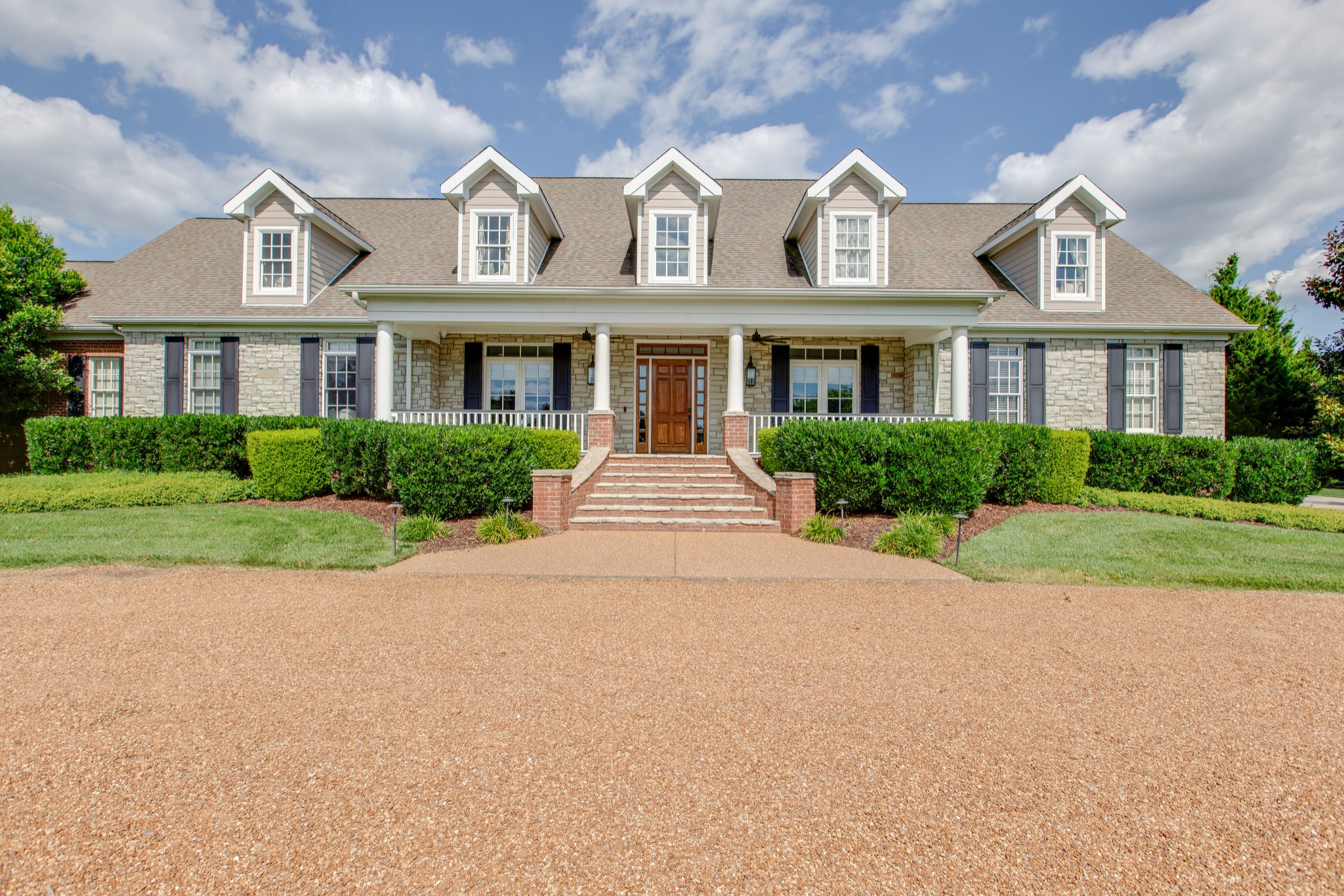 4200 Two Rivers Lane Franklin, TN 37069 - Photo 3 of 44 a front view of a house with a garden
