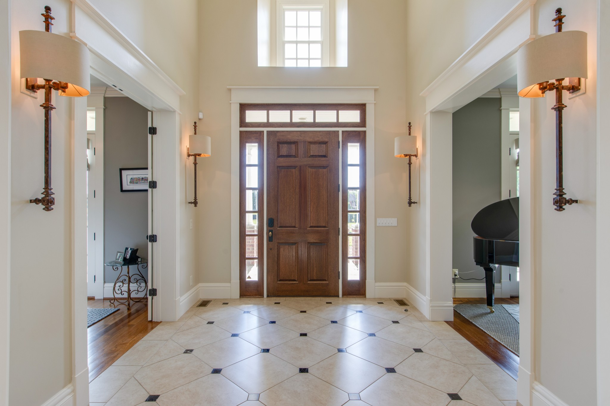 4200 Two Rivers Lane Franklin, TN 37069 - Photo 4 of 44 a view of a hallway with wooden floor and a living room