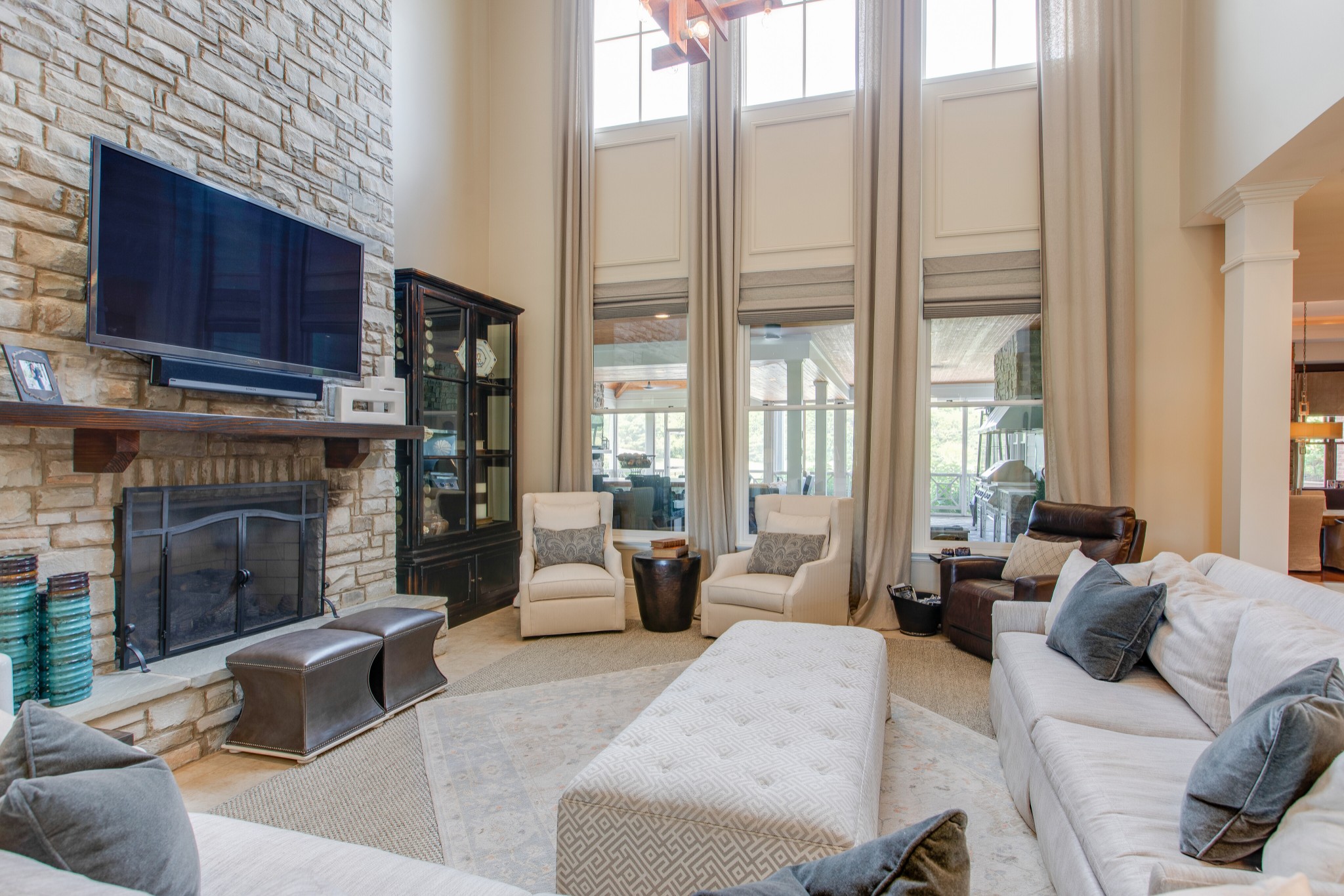 4200 Two Rivers Lane Franklin, TN 37069 - Photo 7 of 44 a living room with furniture large windows and a fireplace