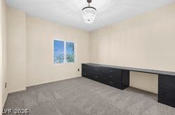 7701 West Robindale Road, Unit 277 Las Vegas, NV 89113 - Photo 13 of 33 A versatile space with neutral tones and a chic lighting fixture, perfect for a home office or creative pursuits.