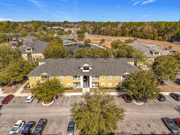 an aerial view of residential houses with outdoor space