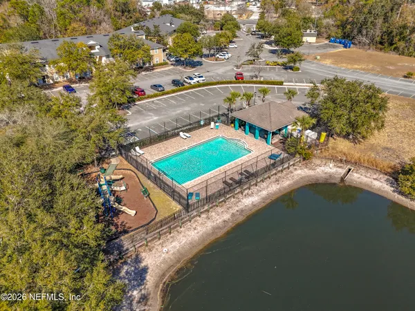 an aerial view of residential houses with outdoor space
