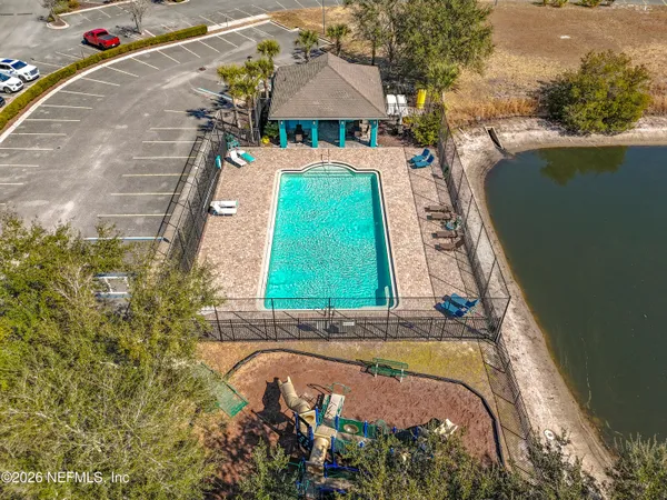a view of swimming pool with a yard