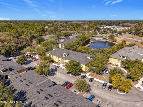 an aerial view of residential houses with outdoor space