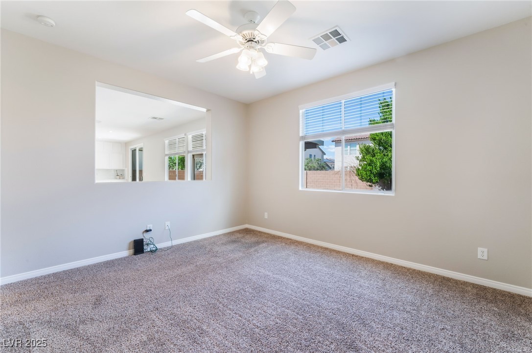7857 Midnight Ride Street Las Vegas, NV 89131 - Photo 14 of 53 Spare room with carpet flooring, baseboards, a smoke detector, and ceiling fan