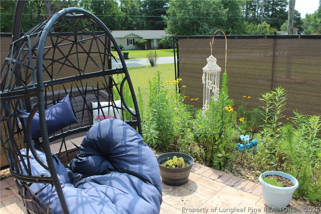 2038 Dunn Road Eastover, NC 28312 - Photo 23 of 29 a backyard of a house with lots of green space and plants