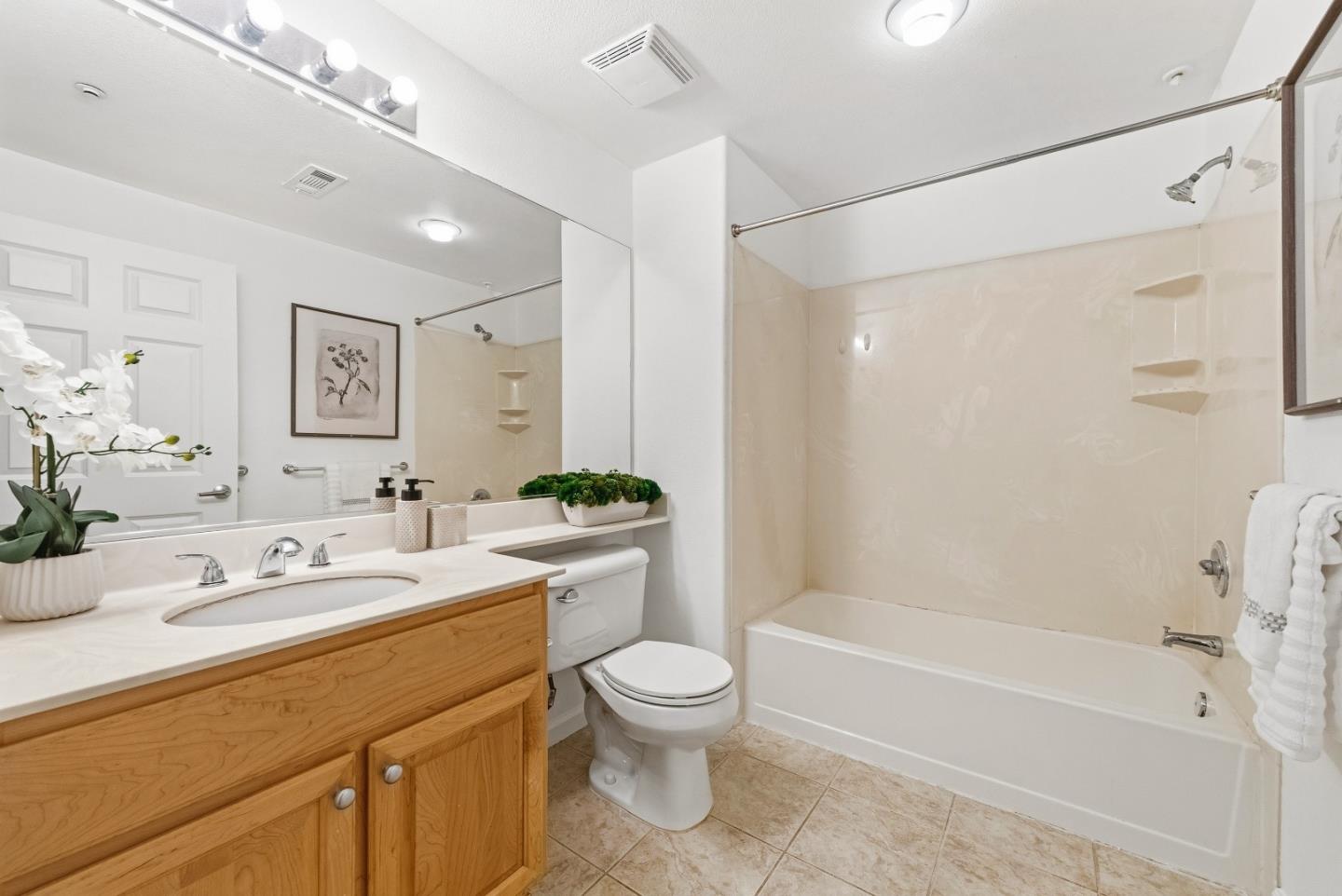 1390 Saddle Rack Street, Unit 223 San Jose, CA 95126 - Photo 19 of 36 a bathroom with a granite countertop sink toilet tub and shower