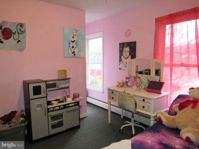 a bedroom with a bed and a table in it