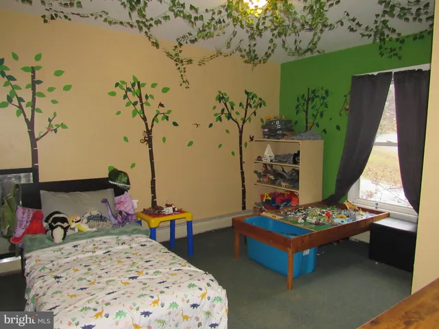 a bedroom with a bed and a mirror