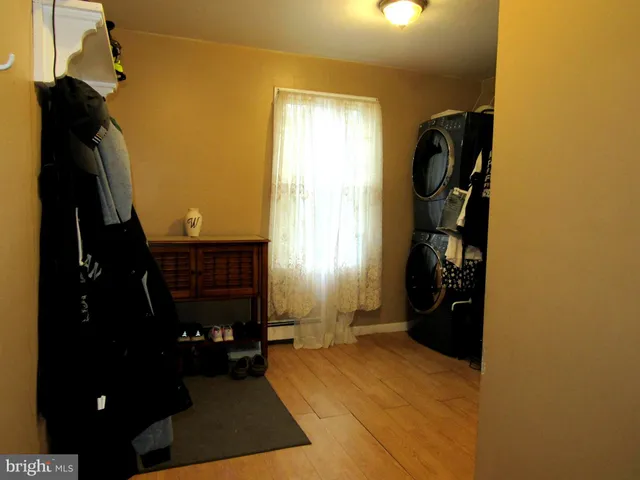 a bathroom with a toilet and a shower curtain