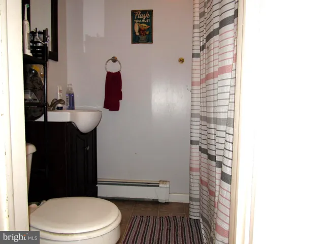 a view of work space with furniture and windows