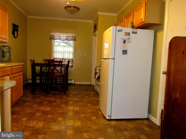 a kitchen with a sink and a refrigerator