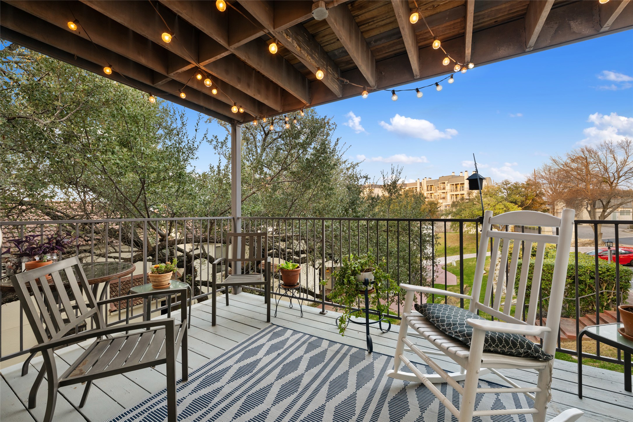 2918 Ranch Road 620 North, Unit C120 Austin, TX 78734 - Photo 12 of 38 a view of a chairs and table in patio