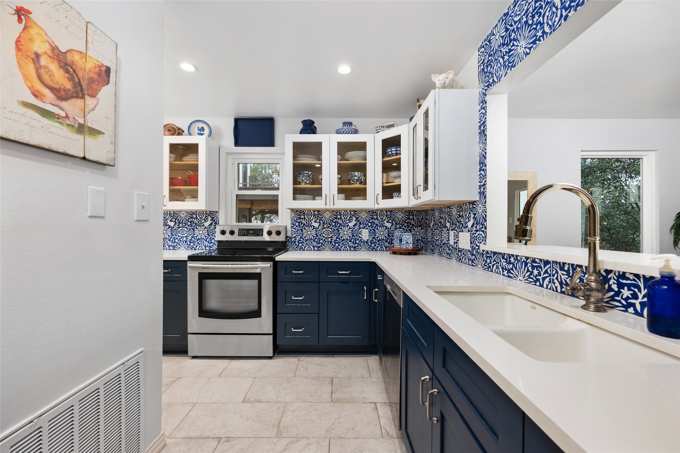 2918 Ranch Road 620 North, Unit C120 Austin, TX 78734 - Photo 15 of 38 a kitchen with stainless steel appliances granite countertop a sink stove and cabinets