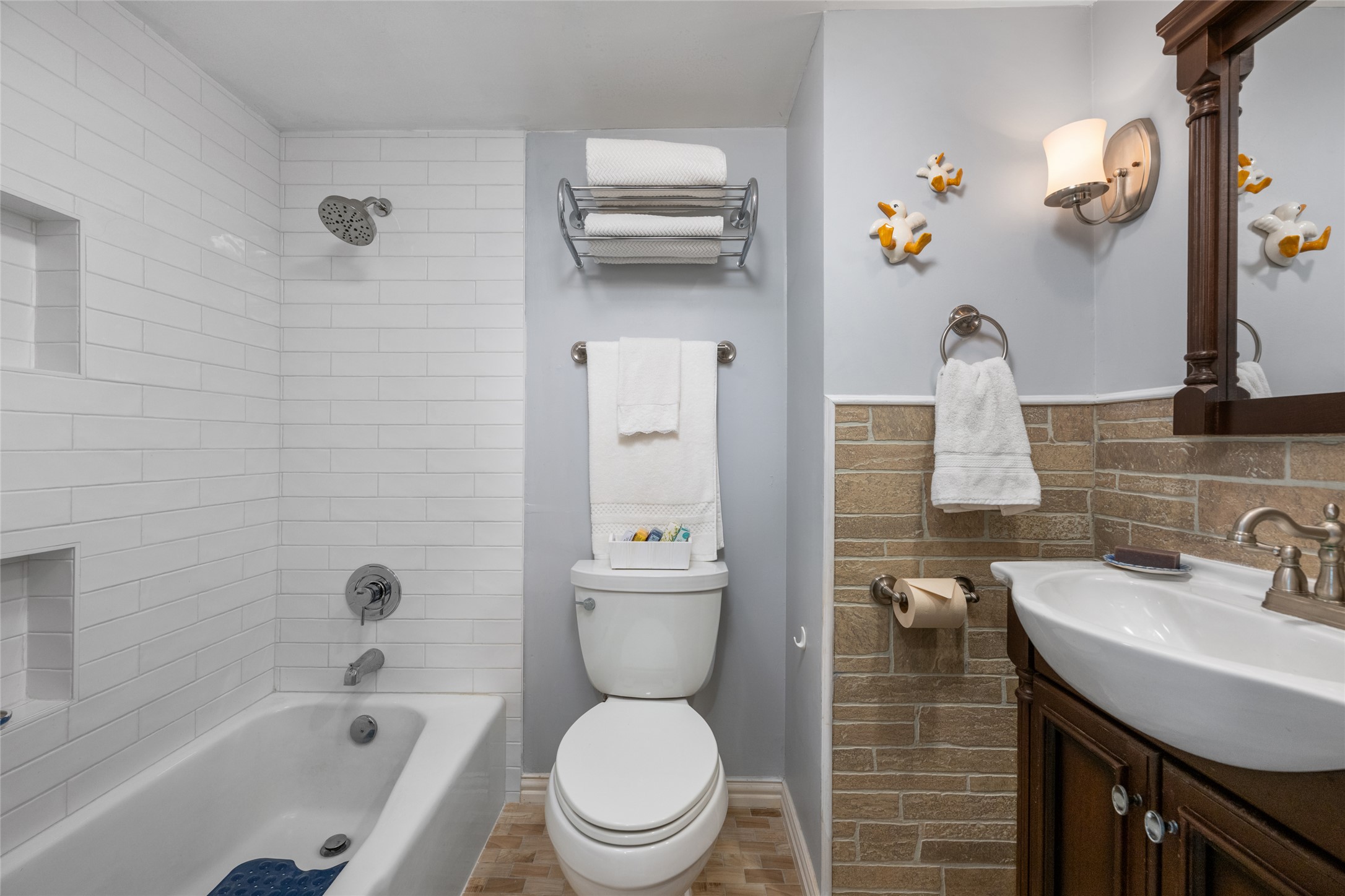 2918 Ranch Road 620 North, Unit C120 Austin, TX 78734 - Photo 23 of 38 a bathroom with a sink a toilet and shower