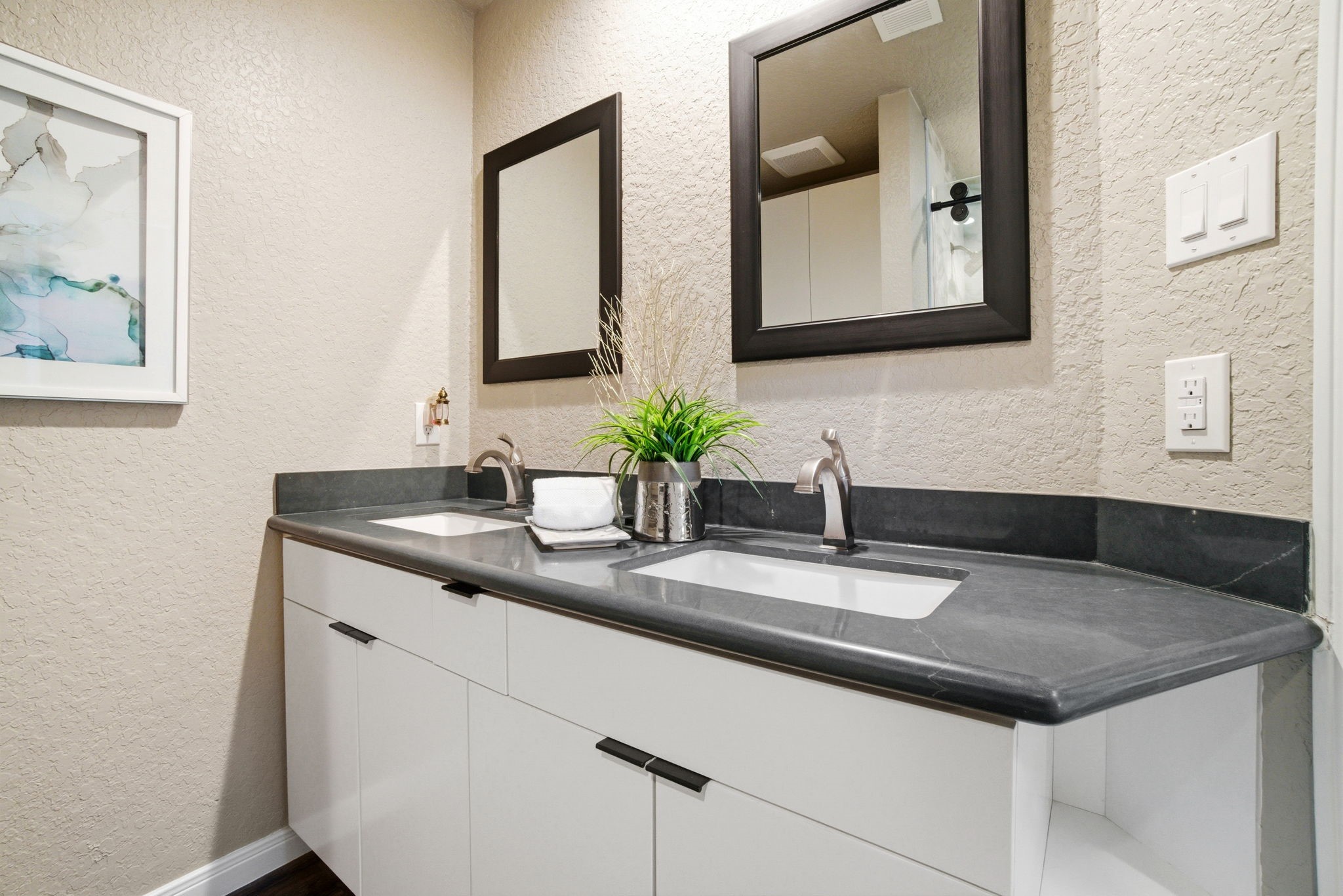 1609 Schooner Point Willis, TX 77318 - Photo 23 of 50 a bathroom with double sink and a mirror