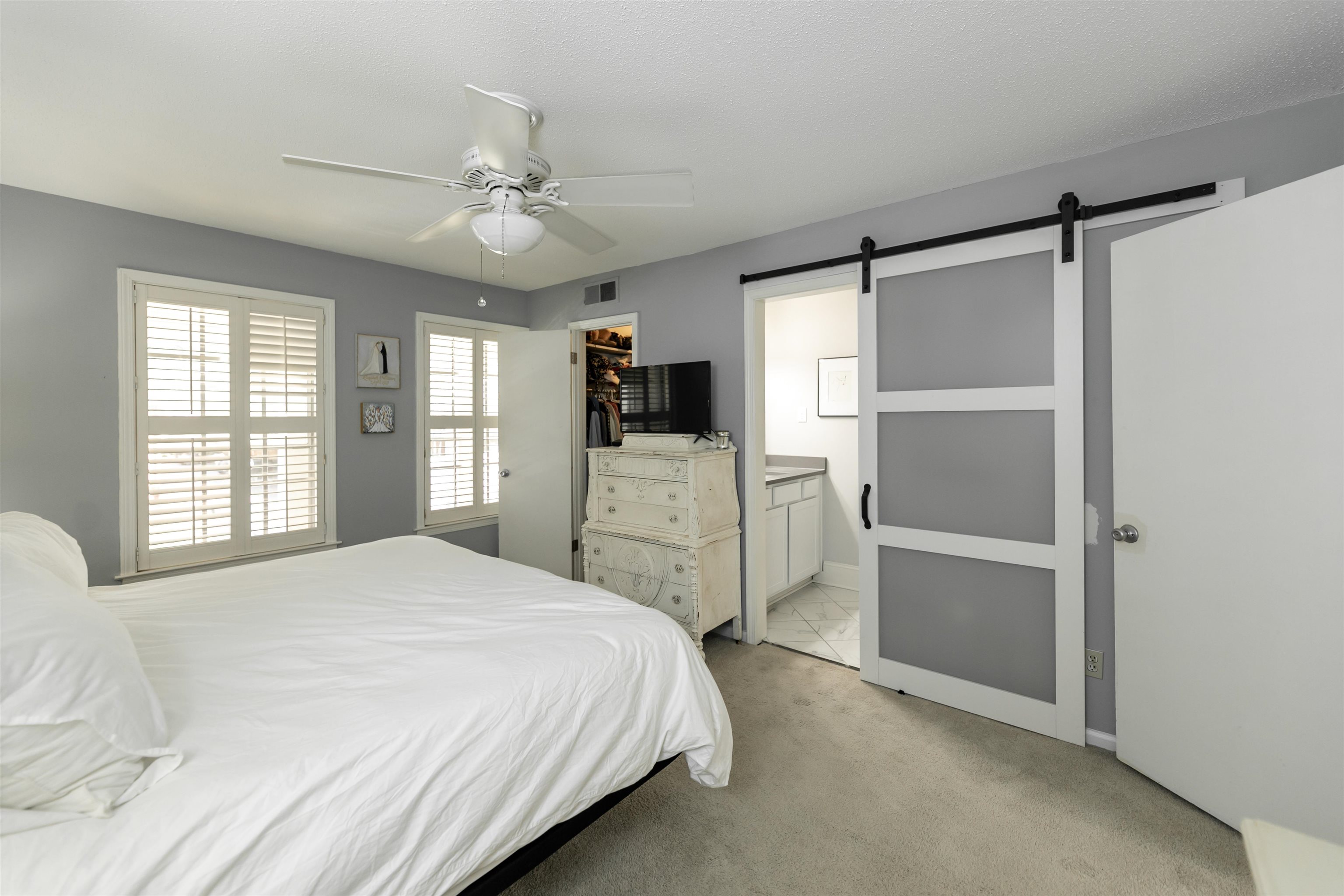 871 South Yates Road, Unit 1 Memphis, TN 38120 - Photo 12 of 23 a bedroom with a bed and a flat tv screen