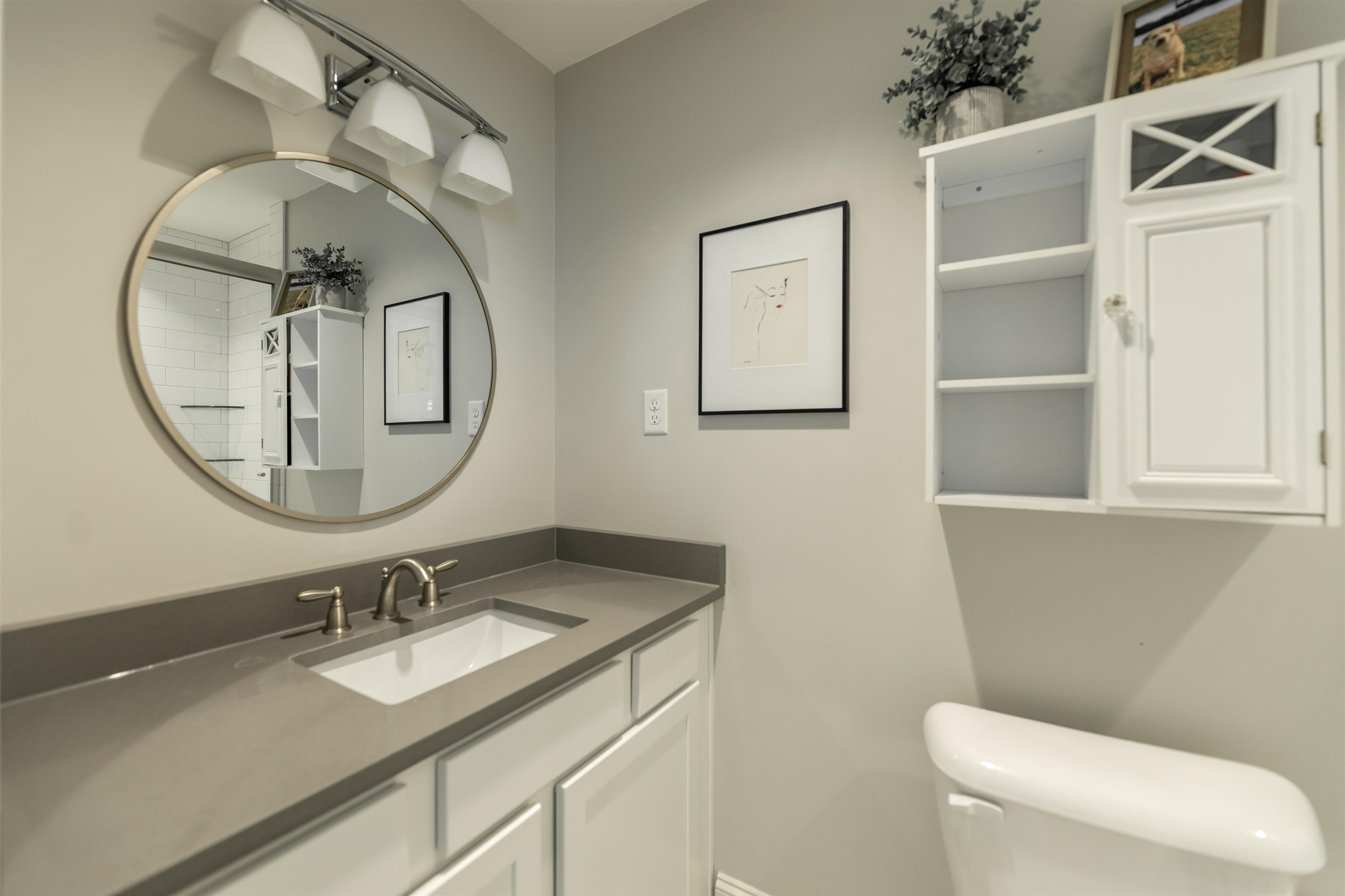 871 South Yates Road, Unit 1 Memphis, TN 38120 - Photo 14 of 23 a bathroom with a granite countertop sink mirror and toilet