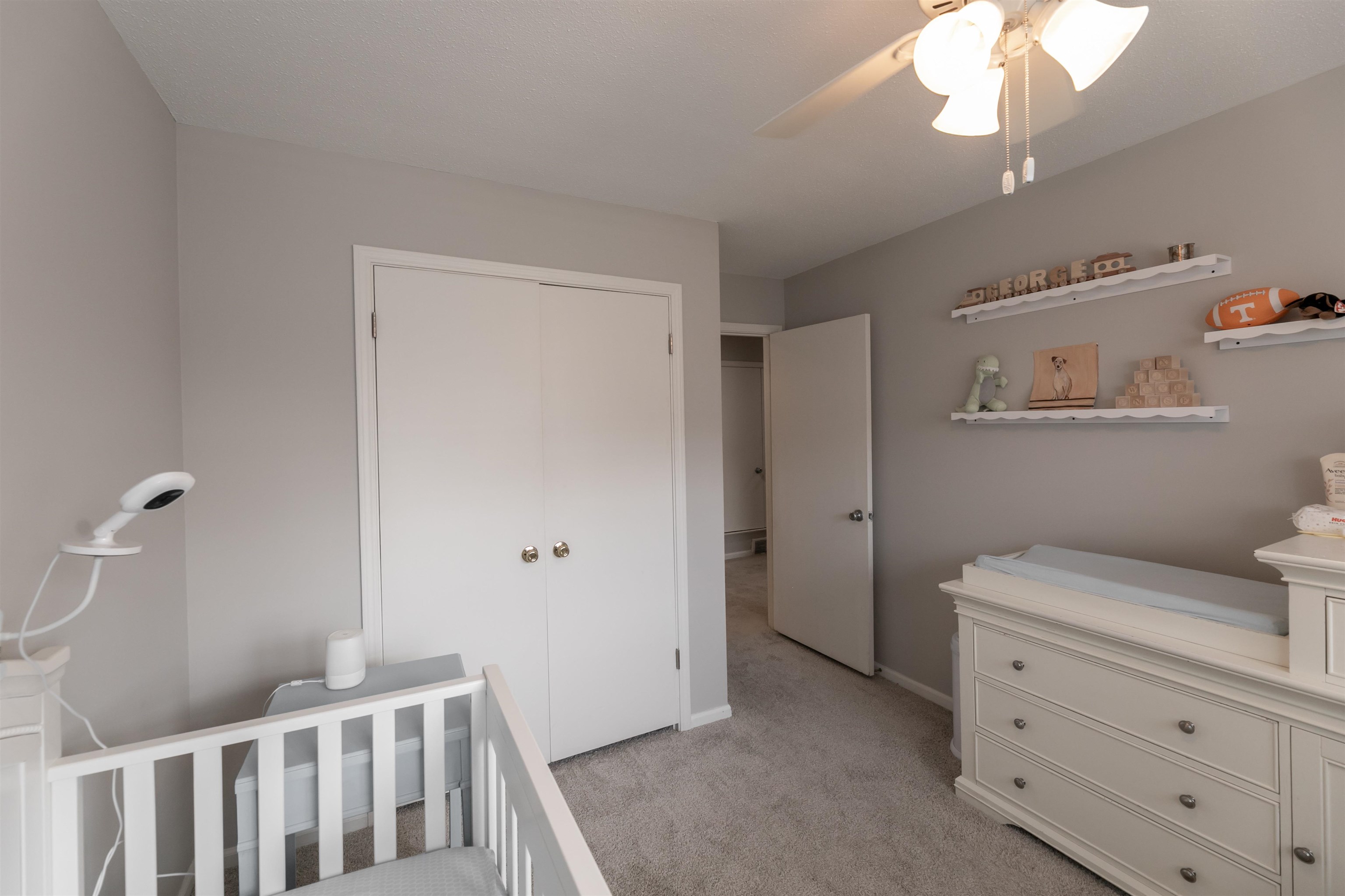 871 South Yates Road, Unit 1 Memphis, TN 38120 - Photo 18 of 23 a bedroom with a bed and a chandelier