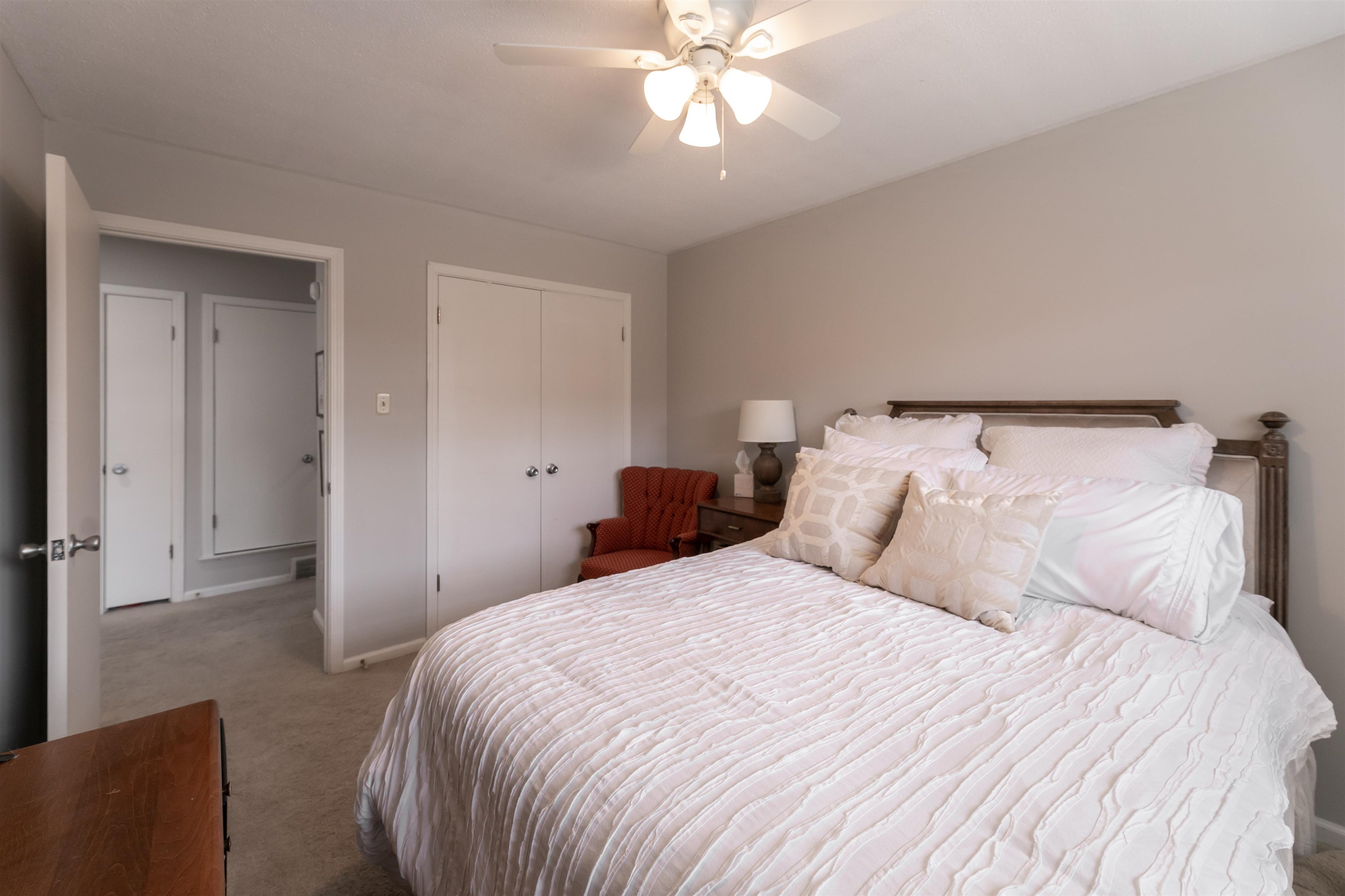 871 South Yates Road, Unit 1 Memphis, TN 38120 - Photo 19 of 23 a bedroom with a bed and a chandelier