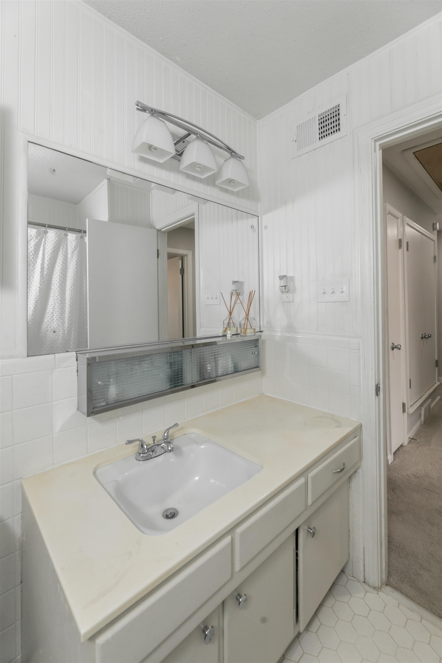 871 South Yates Road, Unit 1 Memphis, TN 38120 - Photo 20 of 23 a bathroom with a sink and a mirror