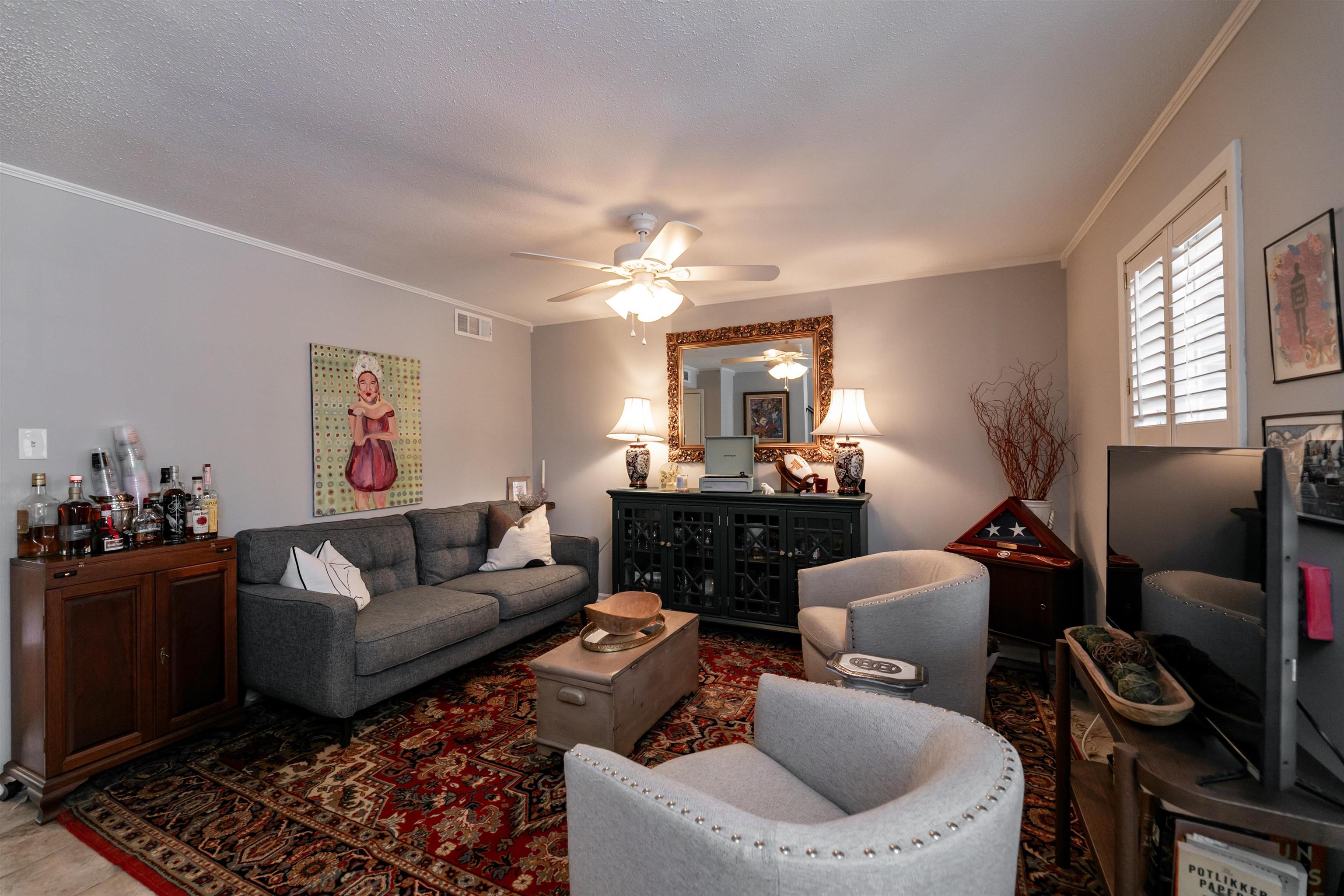 871 South Yates Road, Unit 1 Memphis, TN 38120 - Photo 3 of 23 a living room with furniture and wooden floor