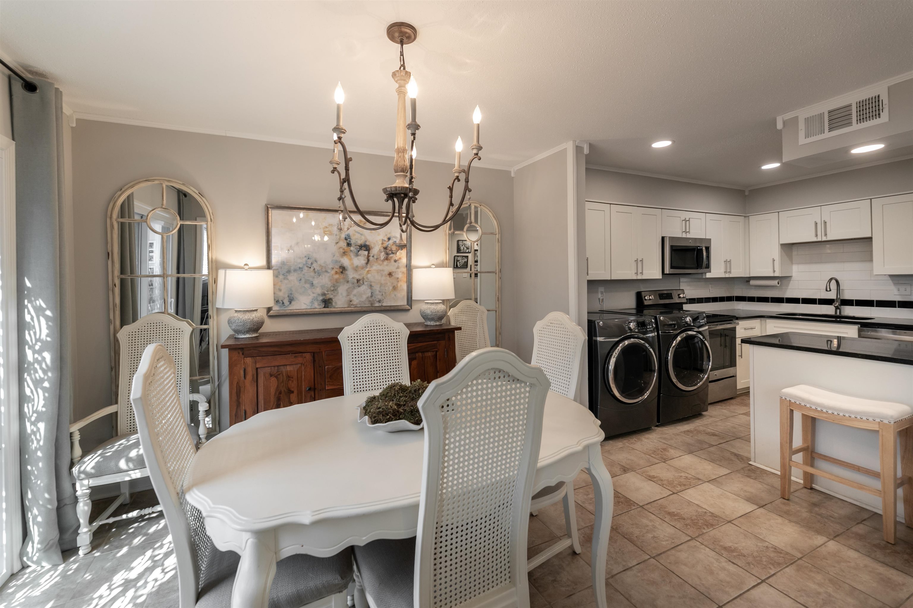 871 South Yates Road, Unit 1 Memphis, TN 38120 - Photo 10 of 23 a kitchen with stainless steel appliances granite countertop a sink a stove a refrigerator cabinets and chairs