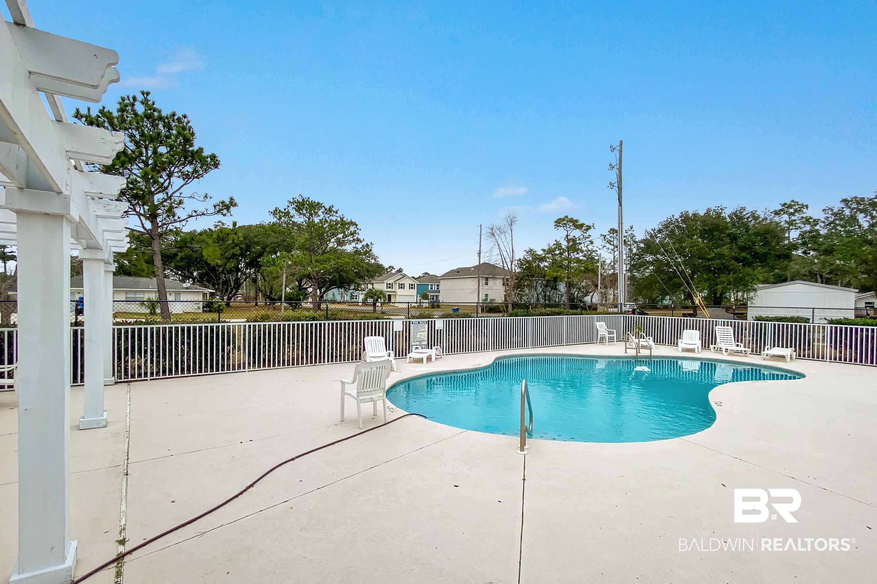 24613 Tarpon Lane Orange Beach, AL 36561 - Photo 3 of 5 View of pool with a patio