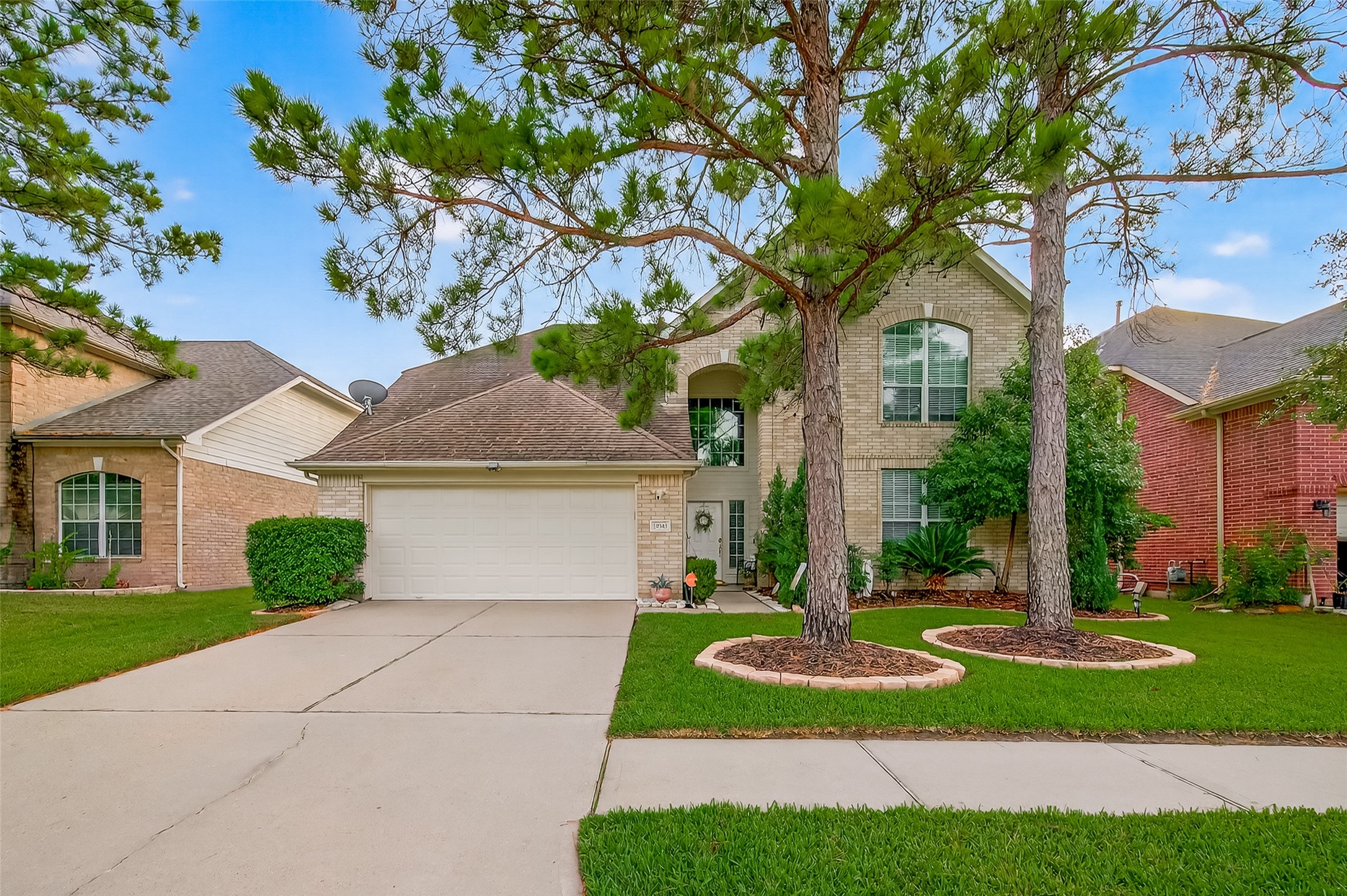 19343 Dickson Park Drive Spring, TX 77373 - Photo 1 of 49 a front view of a house with a yard and trees