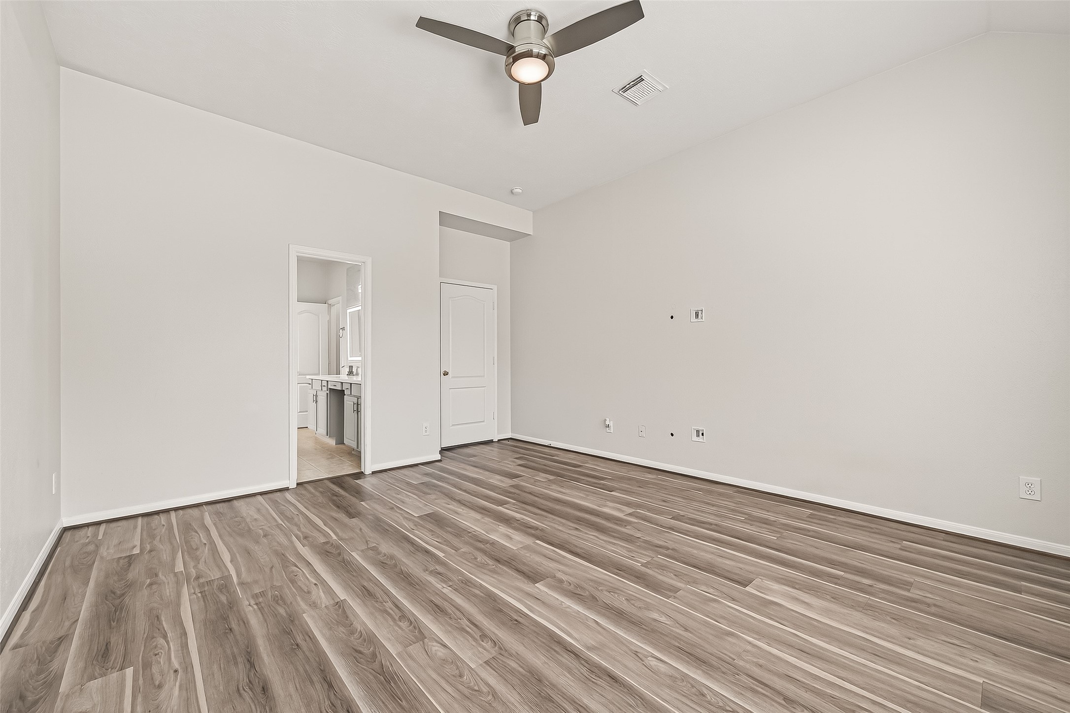 19343 Dickson Park Drive Spring, TX 77373 - Photo 16 of 49 a view of a room with wooden floor and white walls