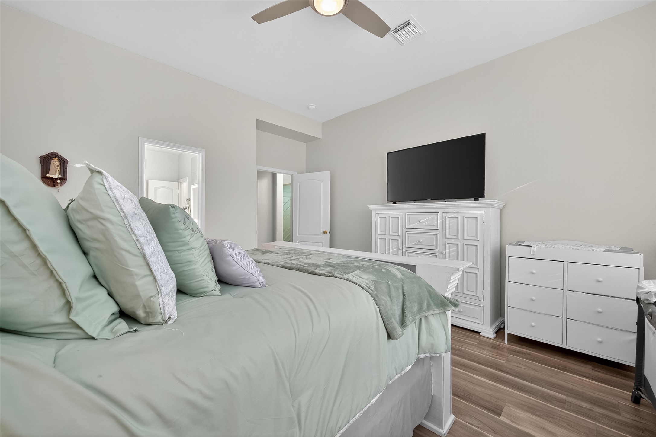 19343 Dickson Park Drive Spring, TX 77373 - Photo 17 of 49 a bedroom with a bed and a flat screen tv