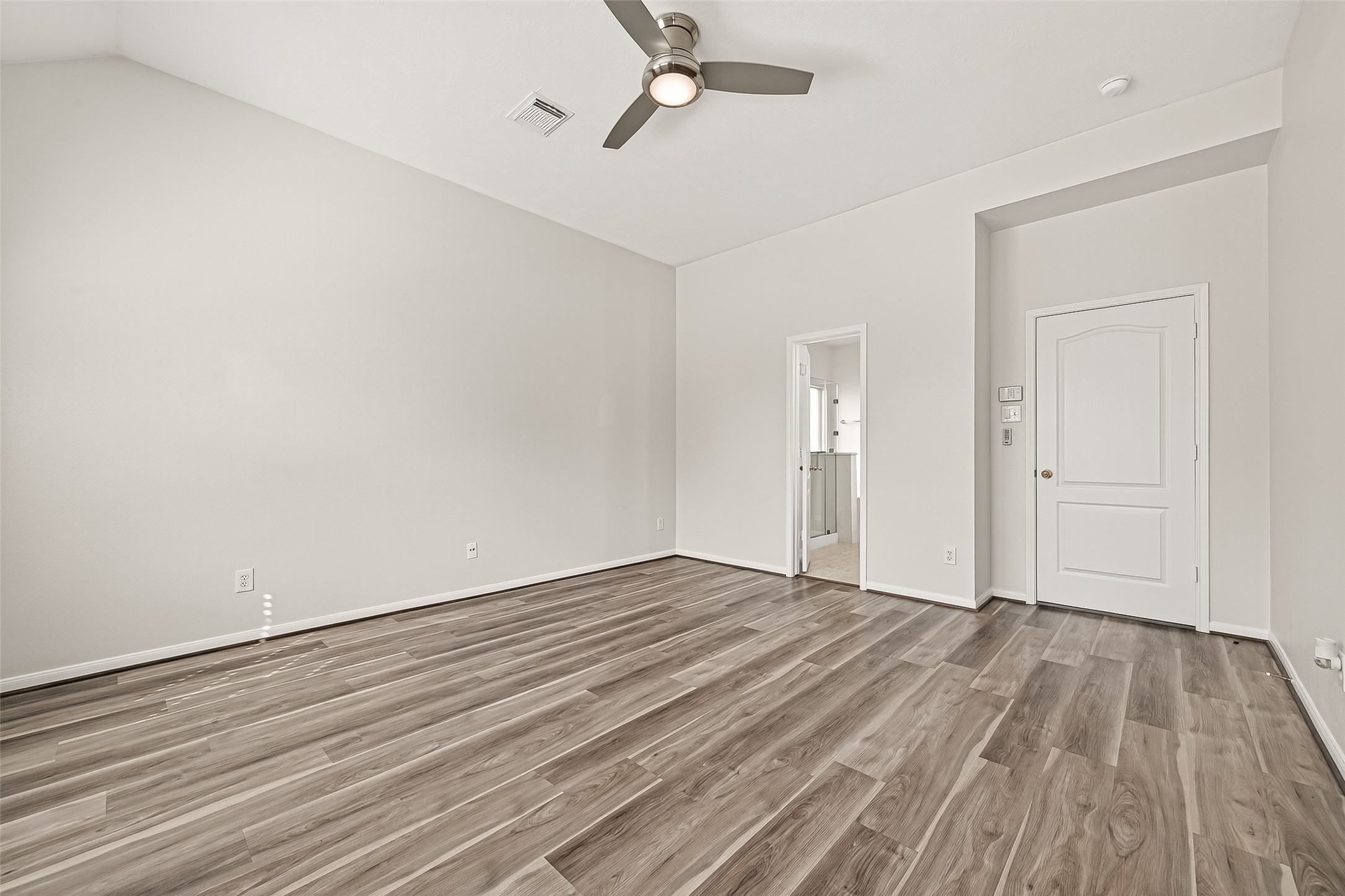 19343 Dickson Park Drive Spring, TX 77373 - Photo 18 of 49 an empty room with wooden floor and windows