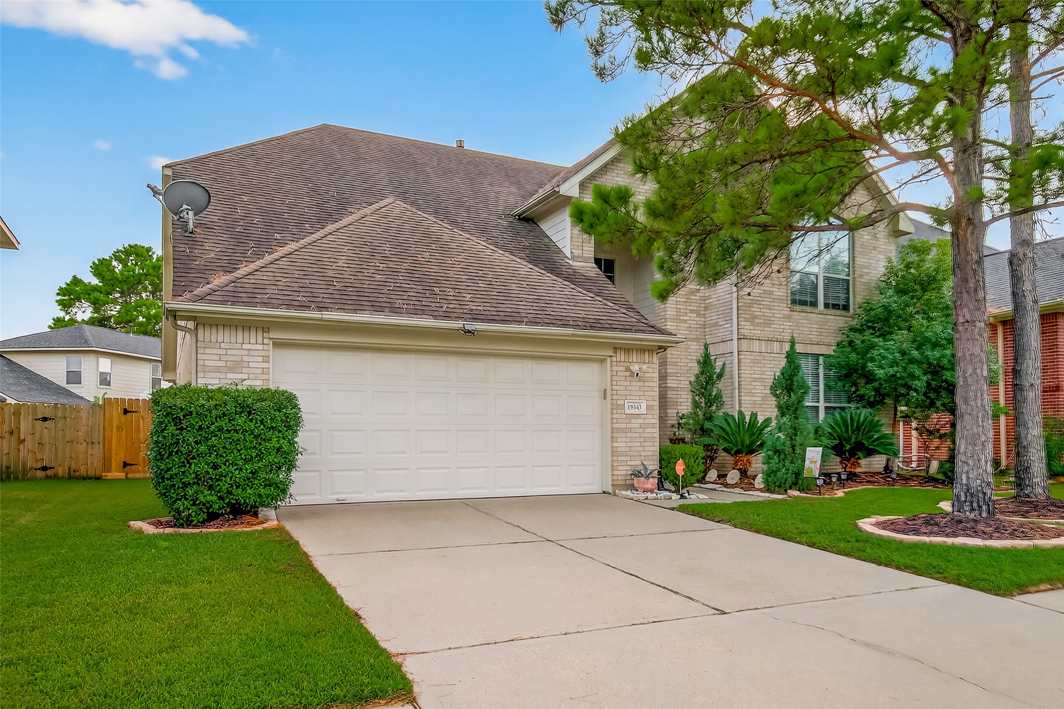 19343 Dickson Park Drive Spring, TX 77373 - Photo 2 of 49 a front view of a house with garden