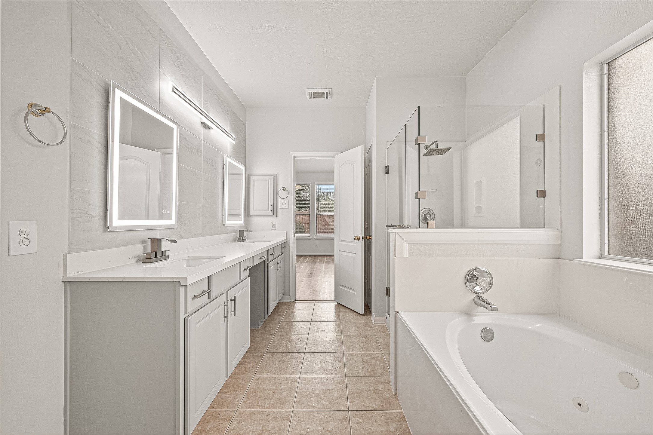 19343 Dickson Park Drive Spring, TX 77373 - Photo 22 of 49 a spacious bathroom with a tub sink and mirror