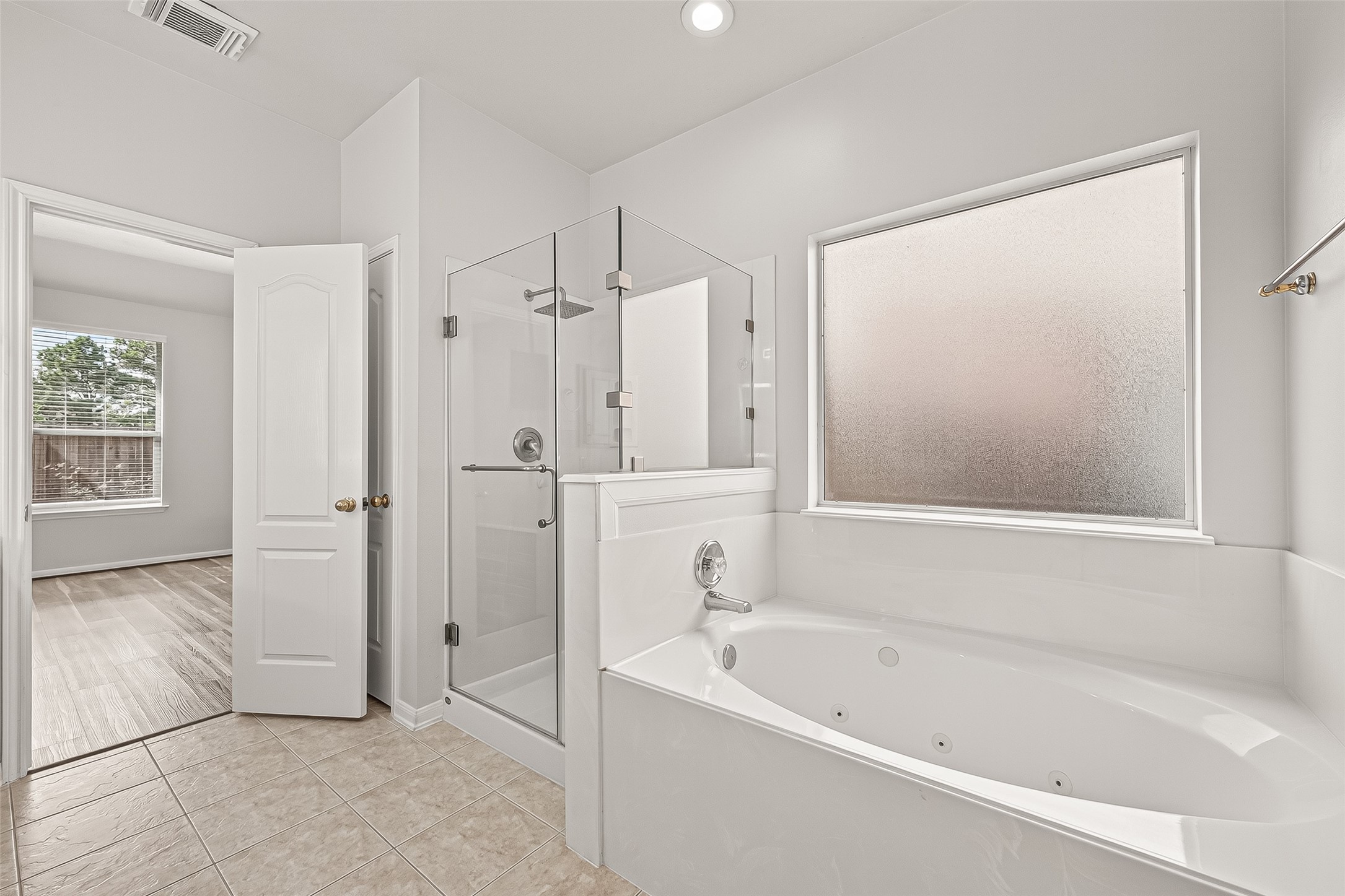 19343 Dickson Park Drive Spring, TX 77373 - Photo 24 of 49 a bathroom with a bathtub and a shower