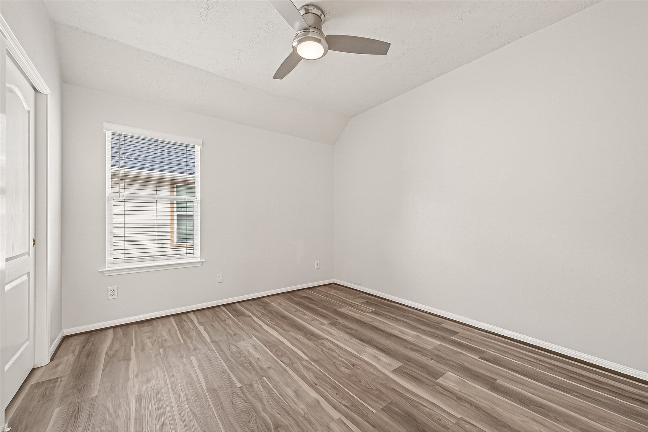 19343 Dickson Park Drive Spring, TX 77373 - Photo 35 of 49 wooden floor in an empty room with a window