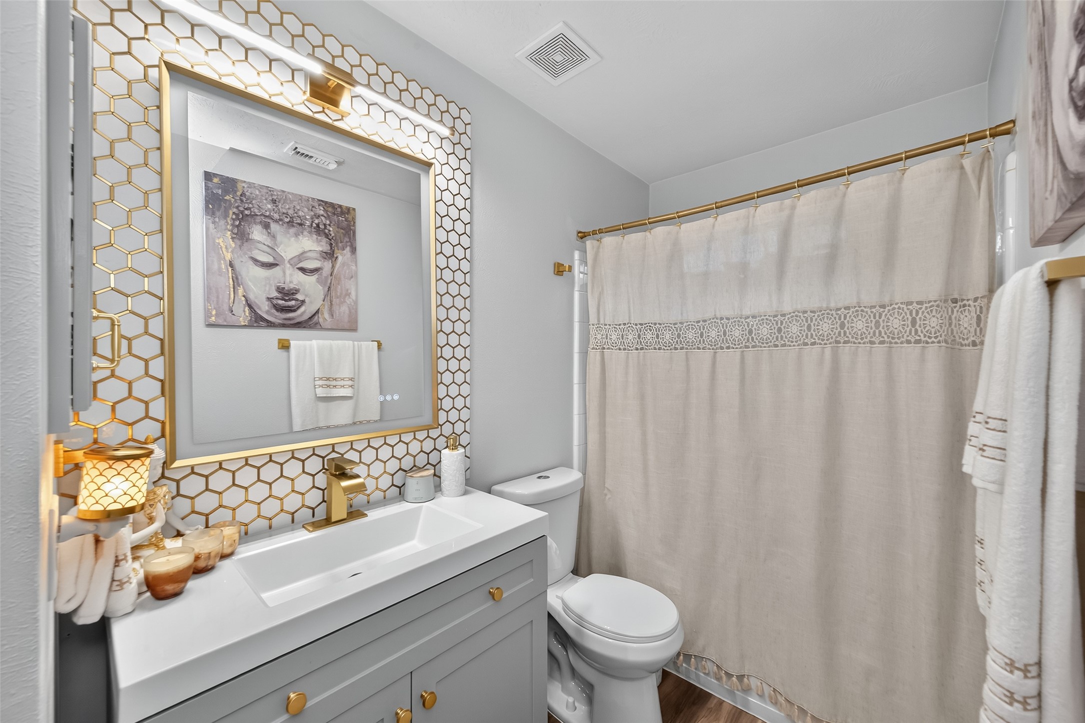 19343 Dickson Park Drive Spring, TX 77373 - Photo 36 of 49 a bathroom with a toilet and a shower curtain