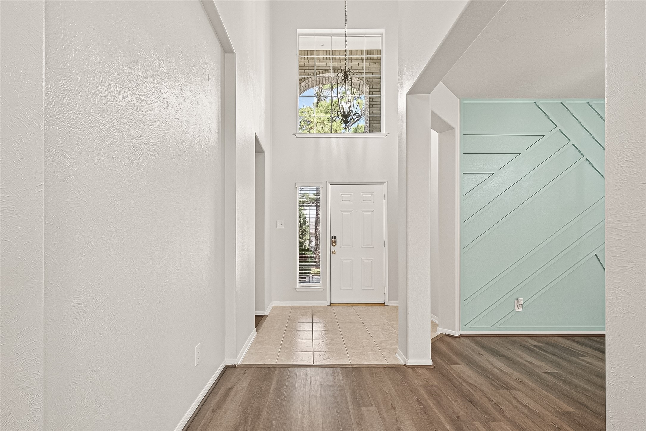 19343 Dickson Park Drive Spring, TX 77373 - Photo 5 of 49 a view of a hallway with wooden floor and a window