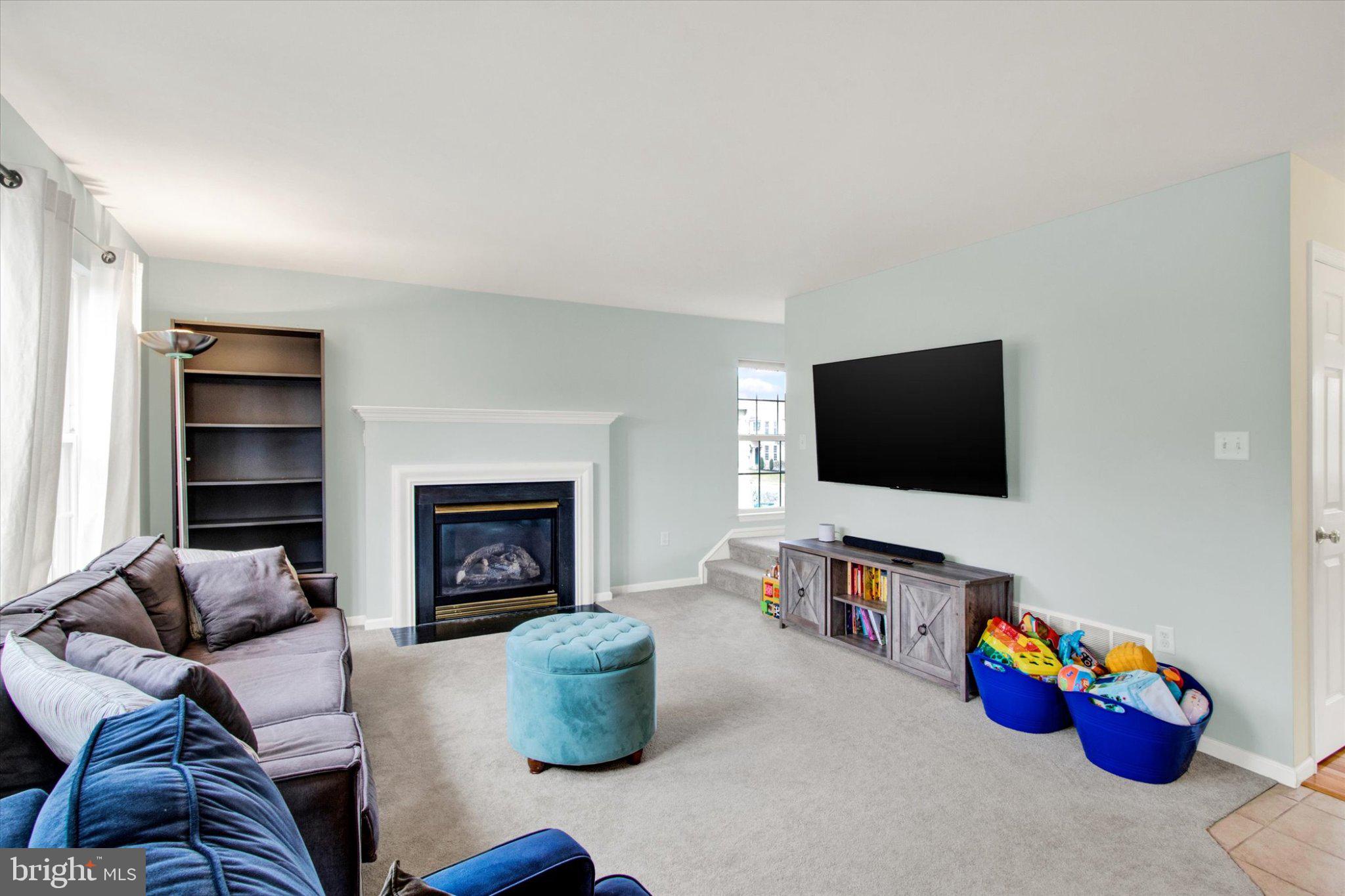 2514 Goddard Avenue Reading, PA 19608 - Photo 14 of 24 a living room with furniture a flat screen tv and a fireplace