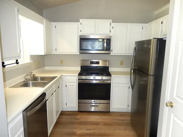 a kitchen with a sink and a stove