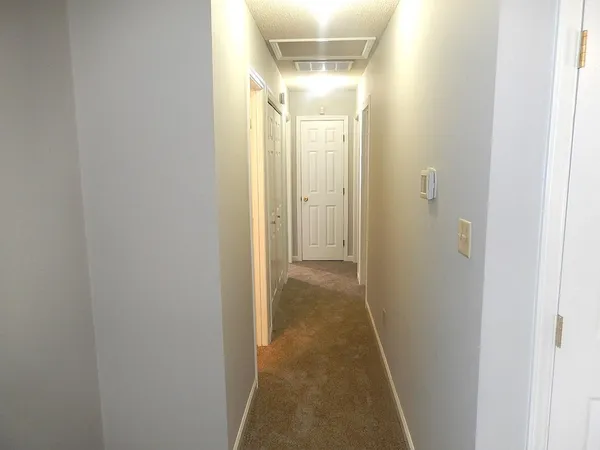 a view of a bathroom from a hallway