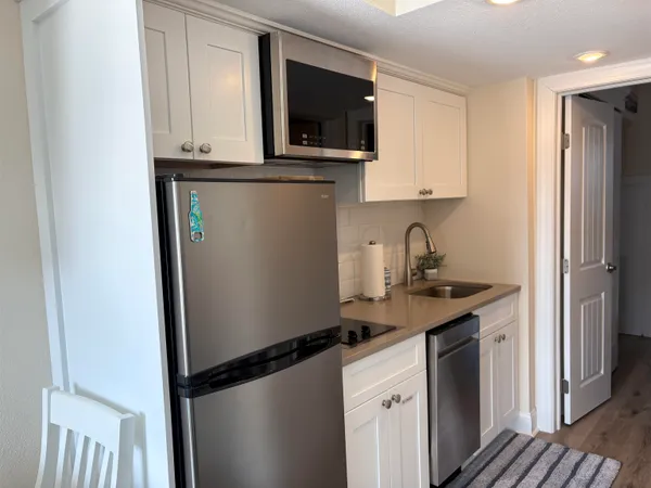 a kitchen with a sink and cabinets