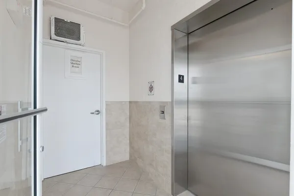 a front view of a building with glass windows and door