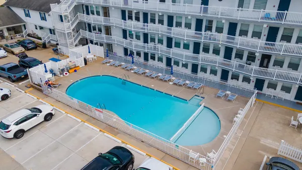 a picture of building with outdoor space and swimming pool