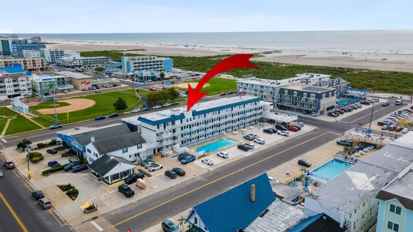 an aerial view of a building with outdoor space