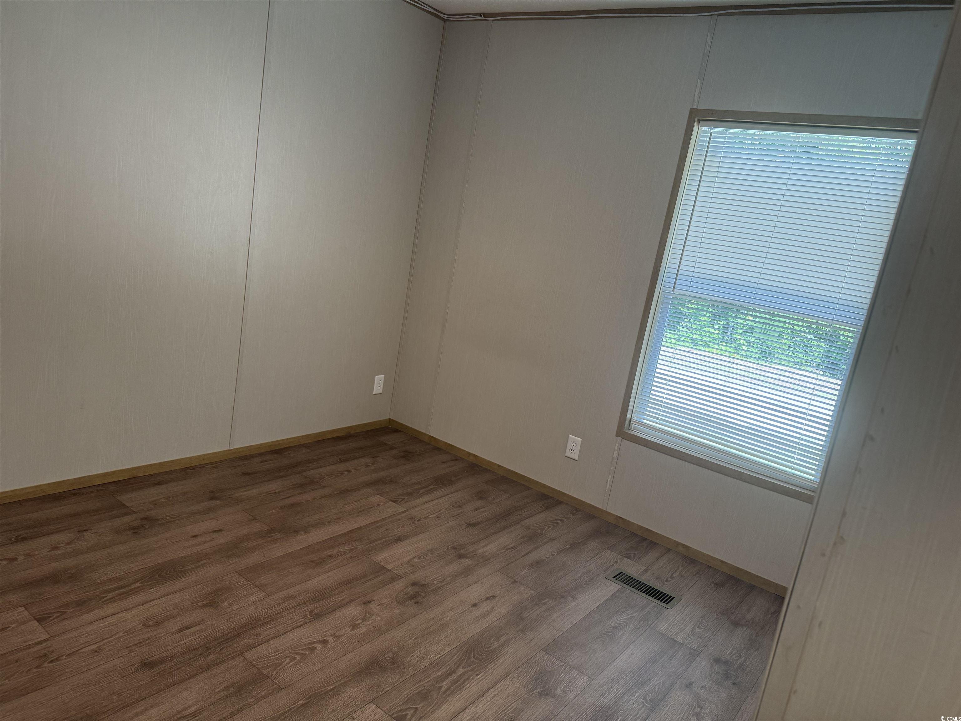 364 Jamie Road Galivants Ferry, SC 29544 - Photo 11 of 23 Spare room featuring wood finished floors and base