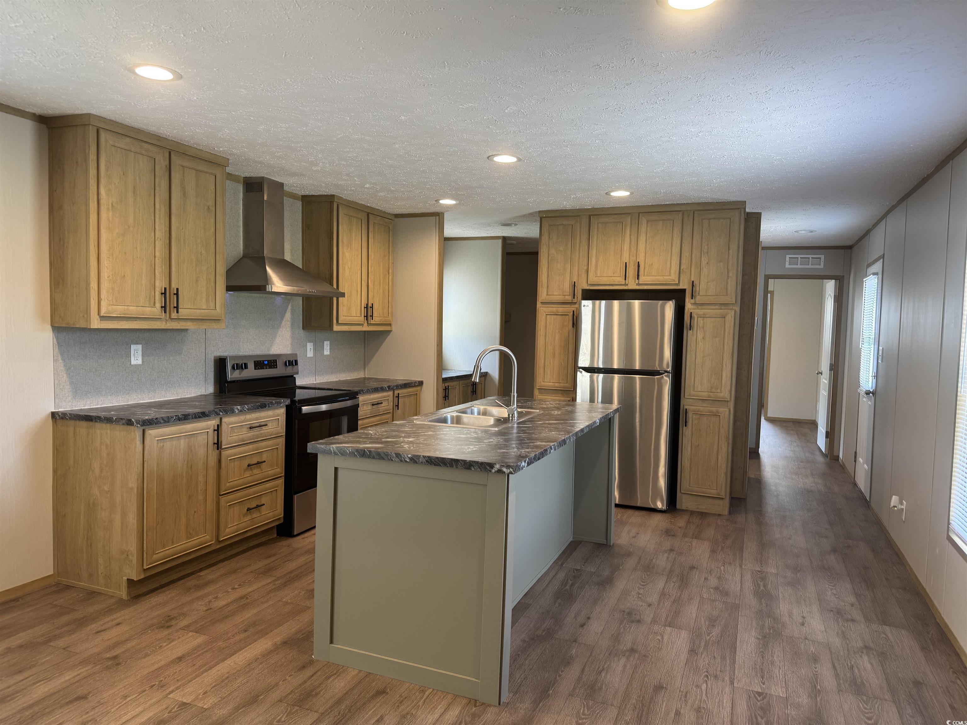 364 Jamie Road Galivants Ferry, SC 29544 - Photo 8 of 23 Kitchen with wall chimney exhaust hood, appliances